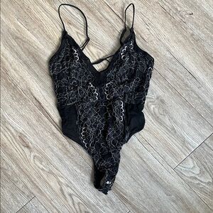 Black Lace Dynamite Strappy Bodysuit